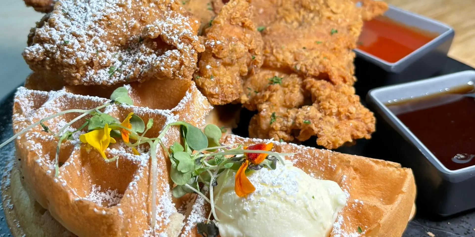 Chicken and waffles with dipping sauces