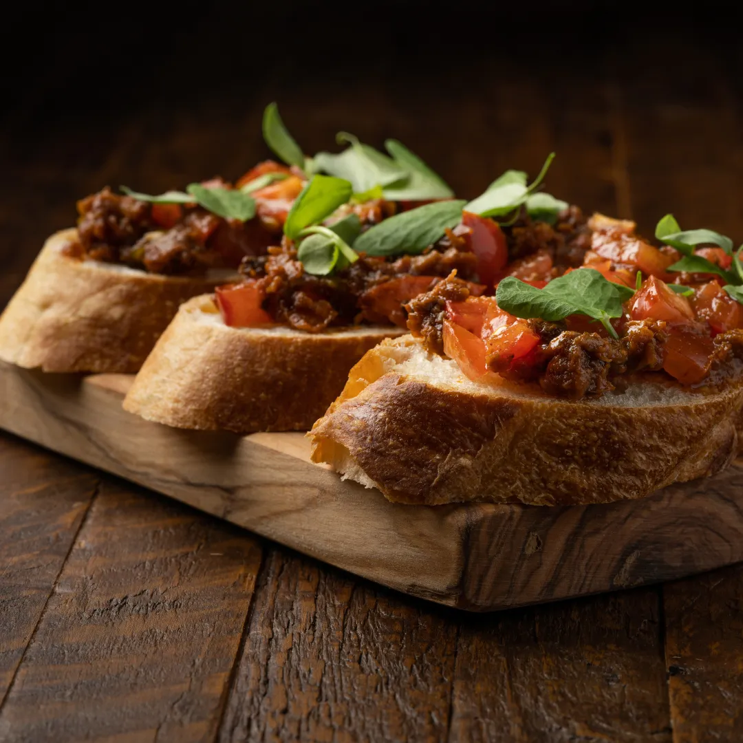 Bruschetta served on a wooden board